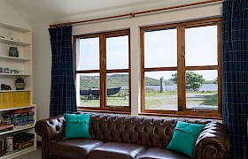 view of the standing stone and loch pottie from the sitting room